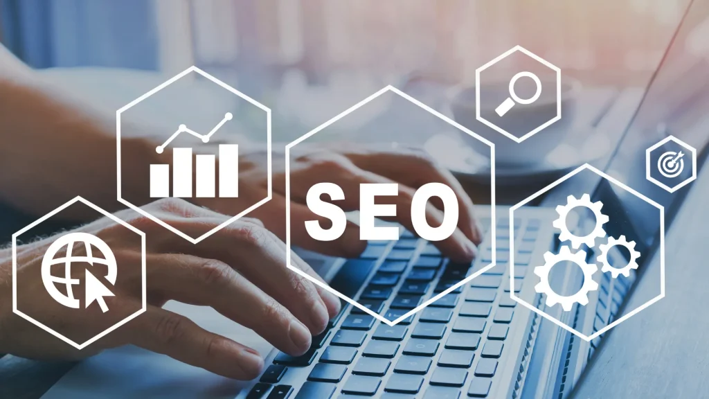 A person typing on a laptop with SEO-related icons overlayed, representing SEO strategies for coaches.