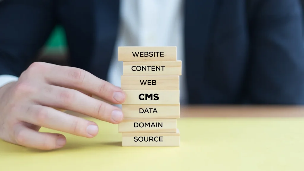 Stacked wooden blocks highlighting the steps of custom CMS SEO migration