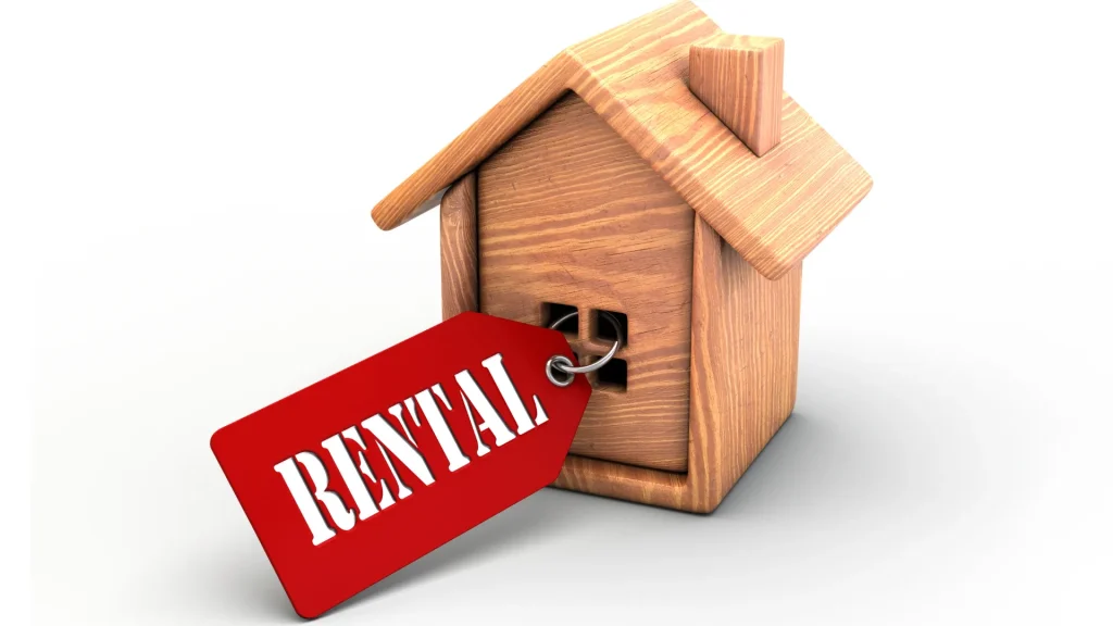 A wooden house with a 'Rental' tag representing SEO for vacation rentals in the property market